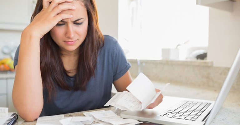 woman struggling to manage debt bills